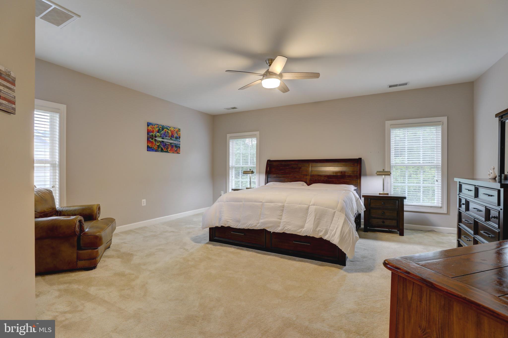 9124 Back Drop Drive Perry Hall, MD 21128 - Photo 29 of 69 a bedroom with a bed and furniture