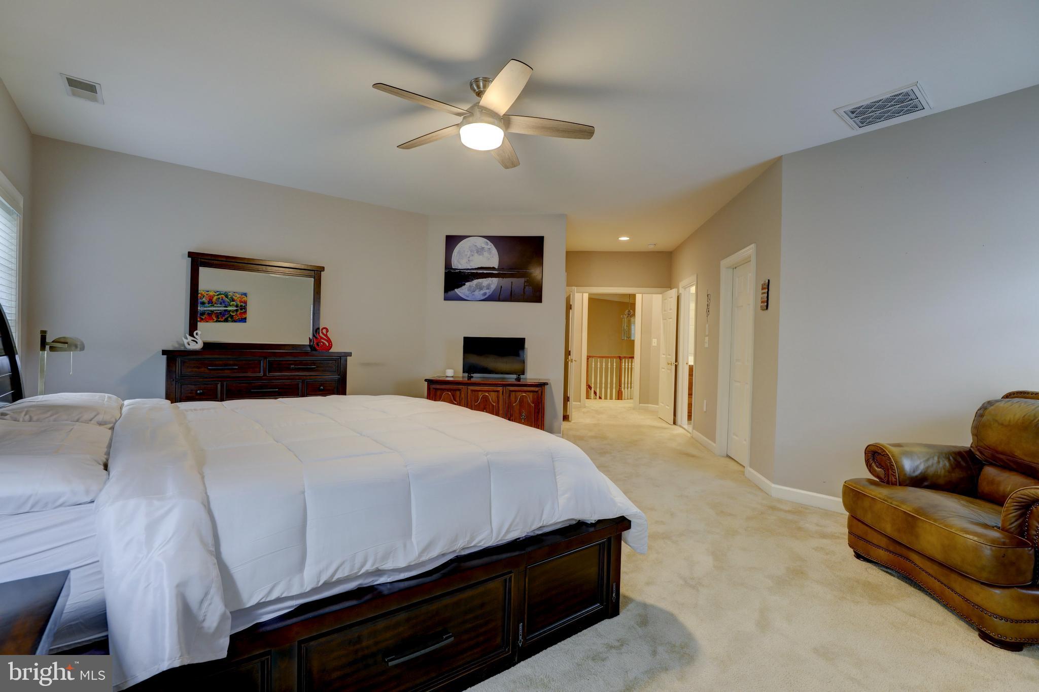 9124 Back Drop Drive Perry Hall, MD 21128 - Photo 30 of 69 a bedroom with a bed and a couch