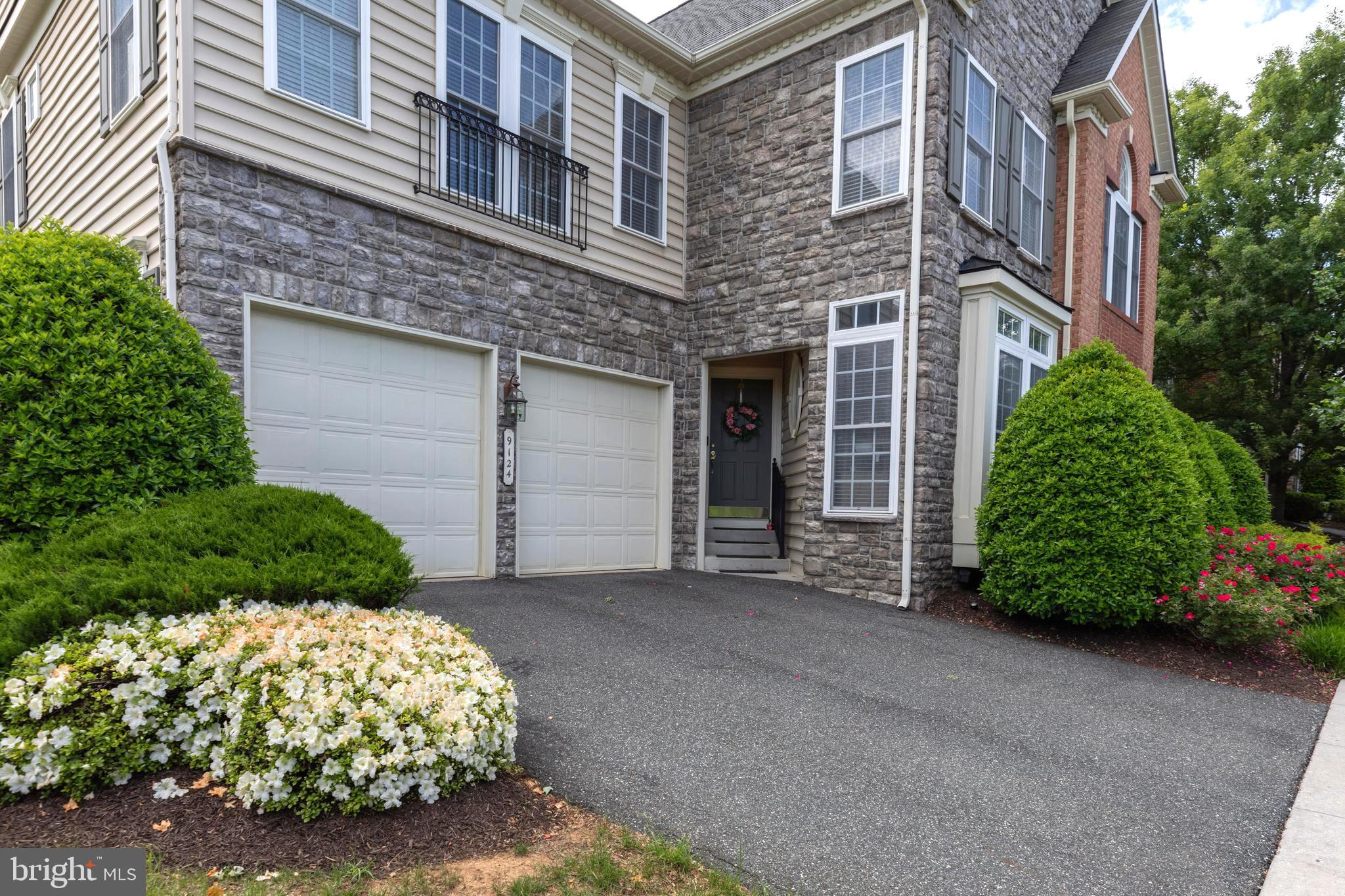 9124 Back Drop Drive Perry Hall, MD 21128 - Photo 3 of 69 a front view of a house with a garden