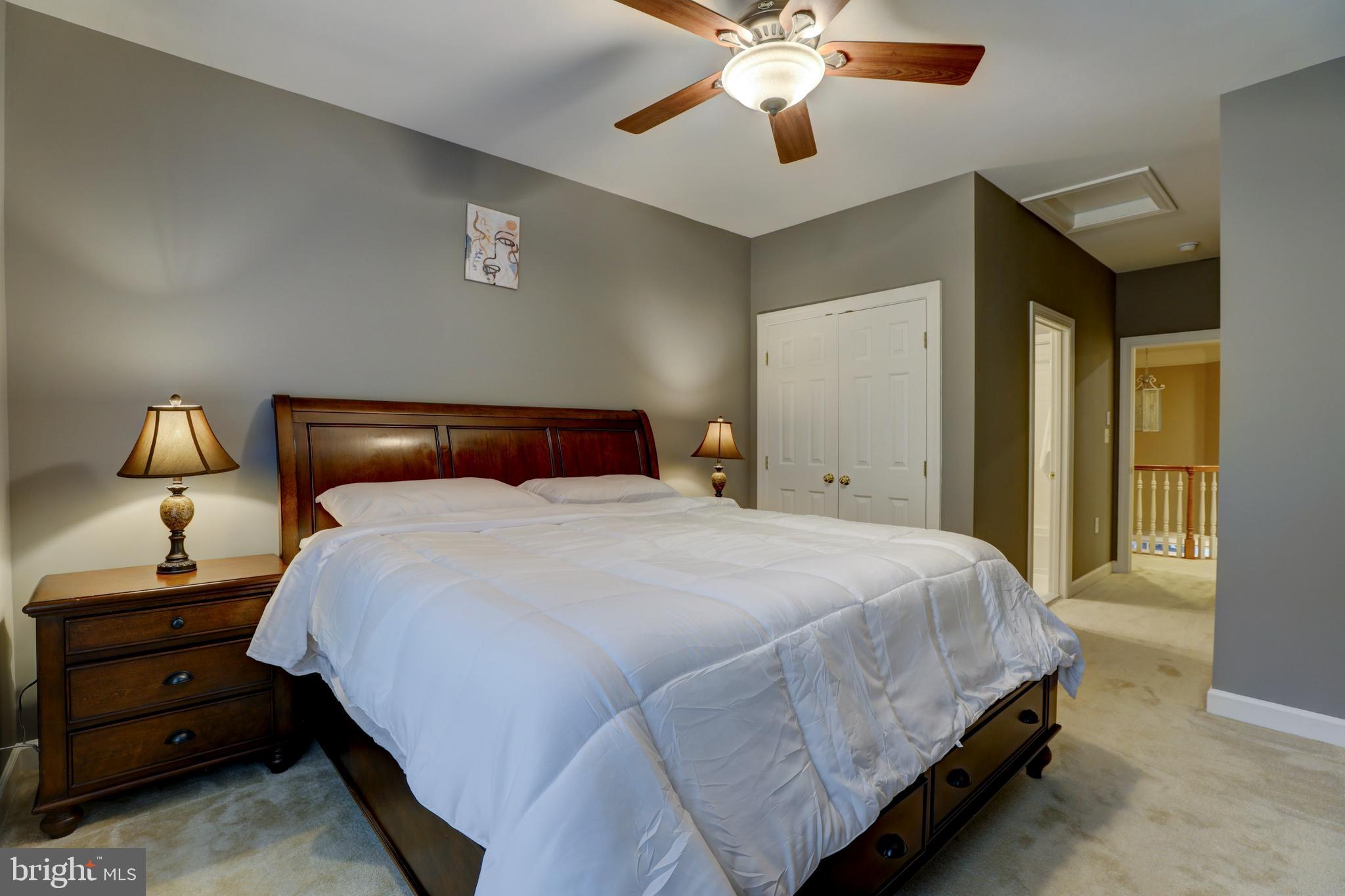 9124 Back Drop Drive Perry Hall, MD 21128 - Photo 37 of 69 a bedroom with a bed and a lamp