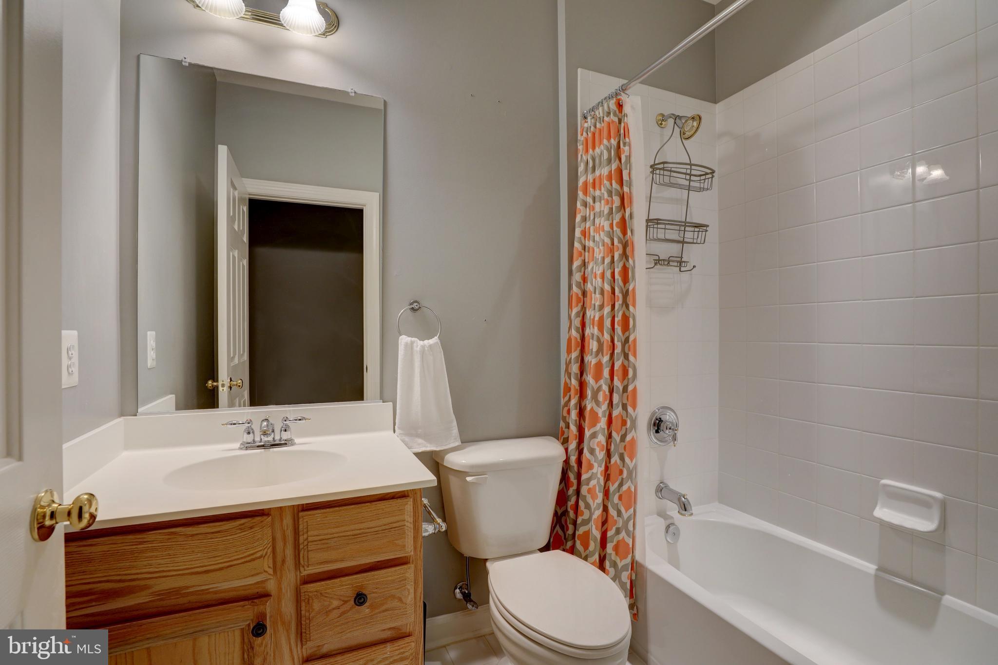 9124 Back Drop Drive Perry Hall, MD 21128 - Photo 38 of 69 a bathroom with a sink a toilet and shower