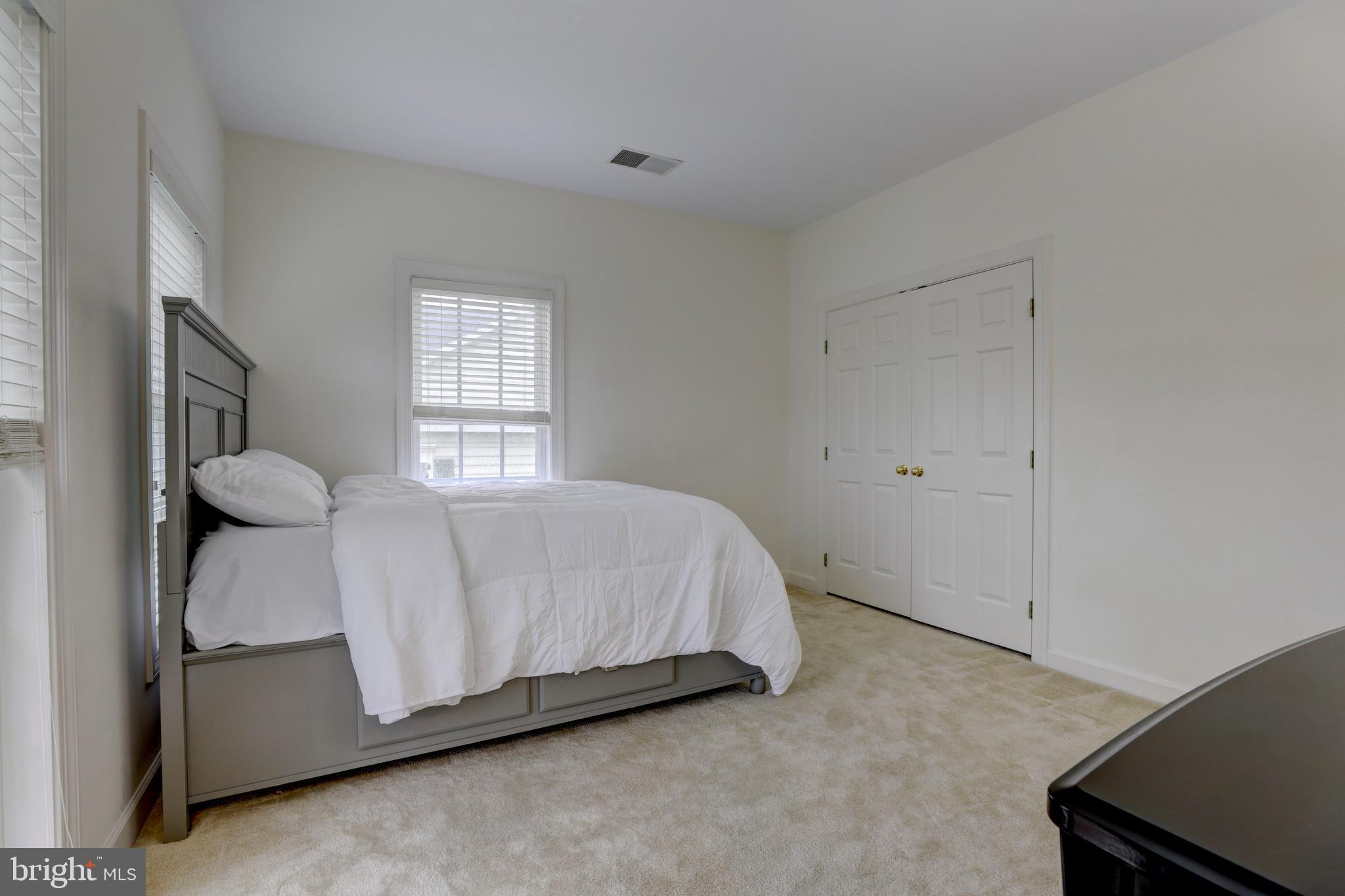 9124 Back Drop Drive Perry Hall, MD 21128 - Photo 41 of 69 a bed sitting in a room next to a window