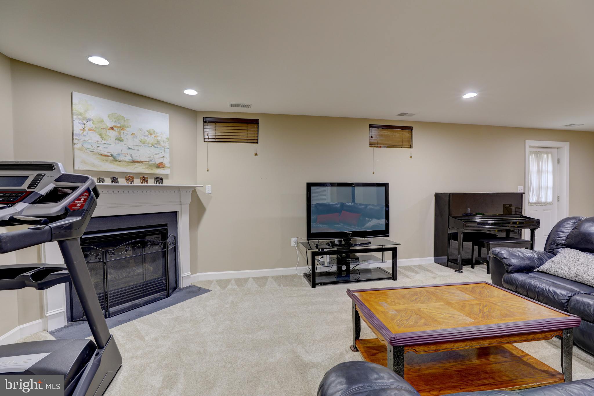 9124 Back Drop Drive Perry Hall, MD 21128 - Photo 45 of 69 a living room with furniture a flat screen tv and kitchen view