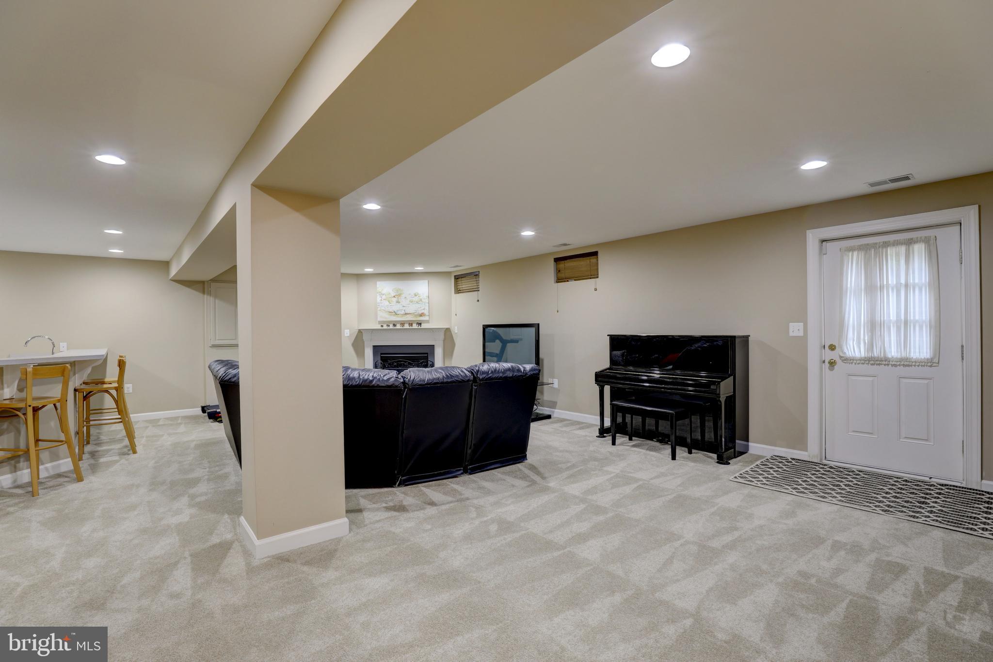 9124 Back Drop Drive Perry Hall, MD 21128 - Photo 46 of 69 a living room with furniture and a flat screen tv