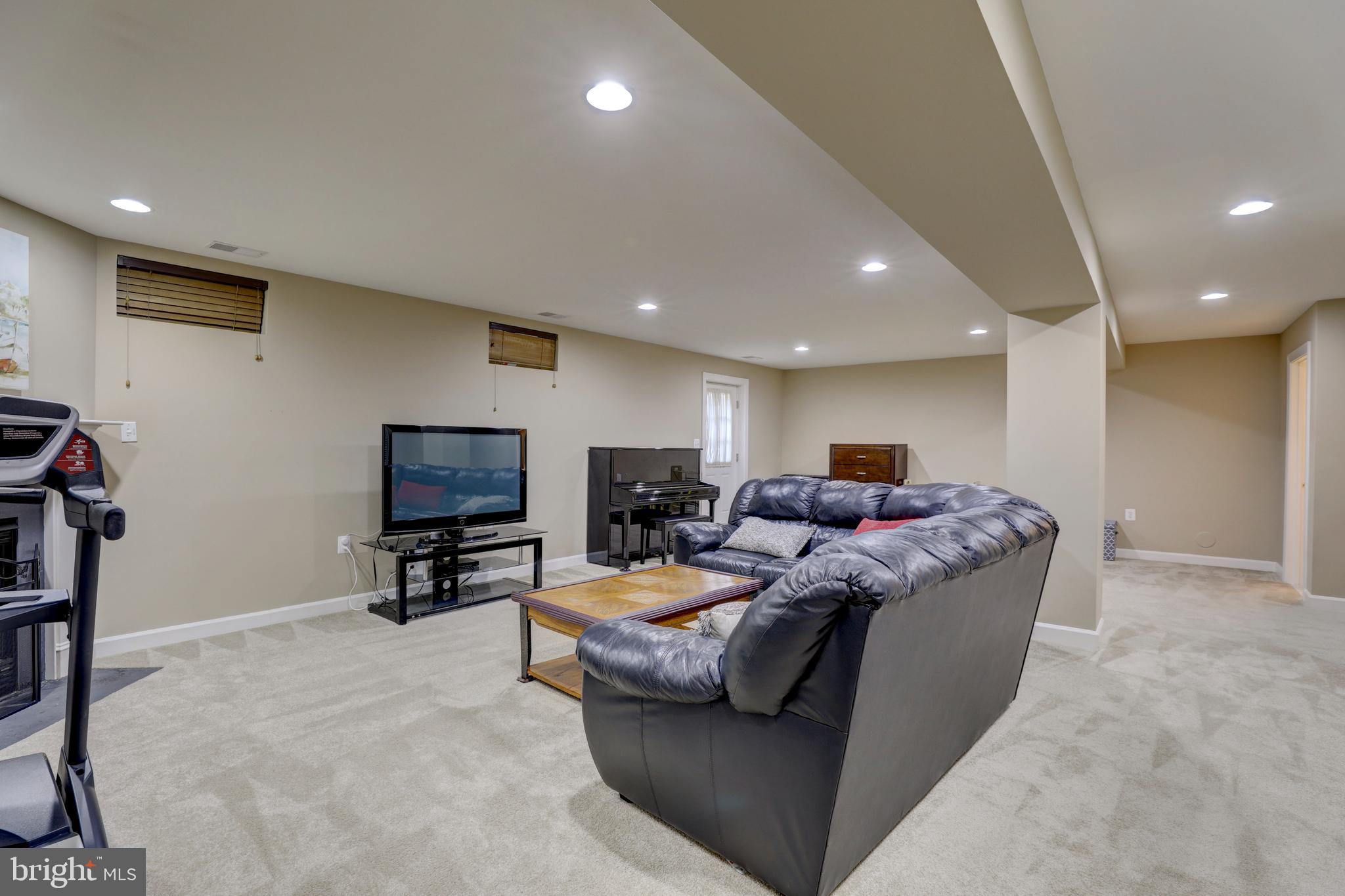 9124 Back Drop Drive Perry Hall, MD 21128 - Photo 48 of 69 a living room with furniture and a flat screen tv
