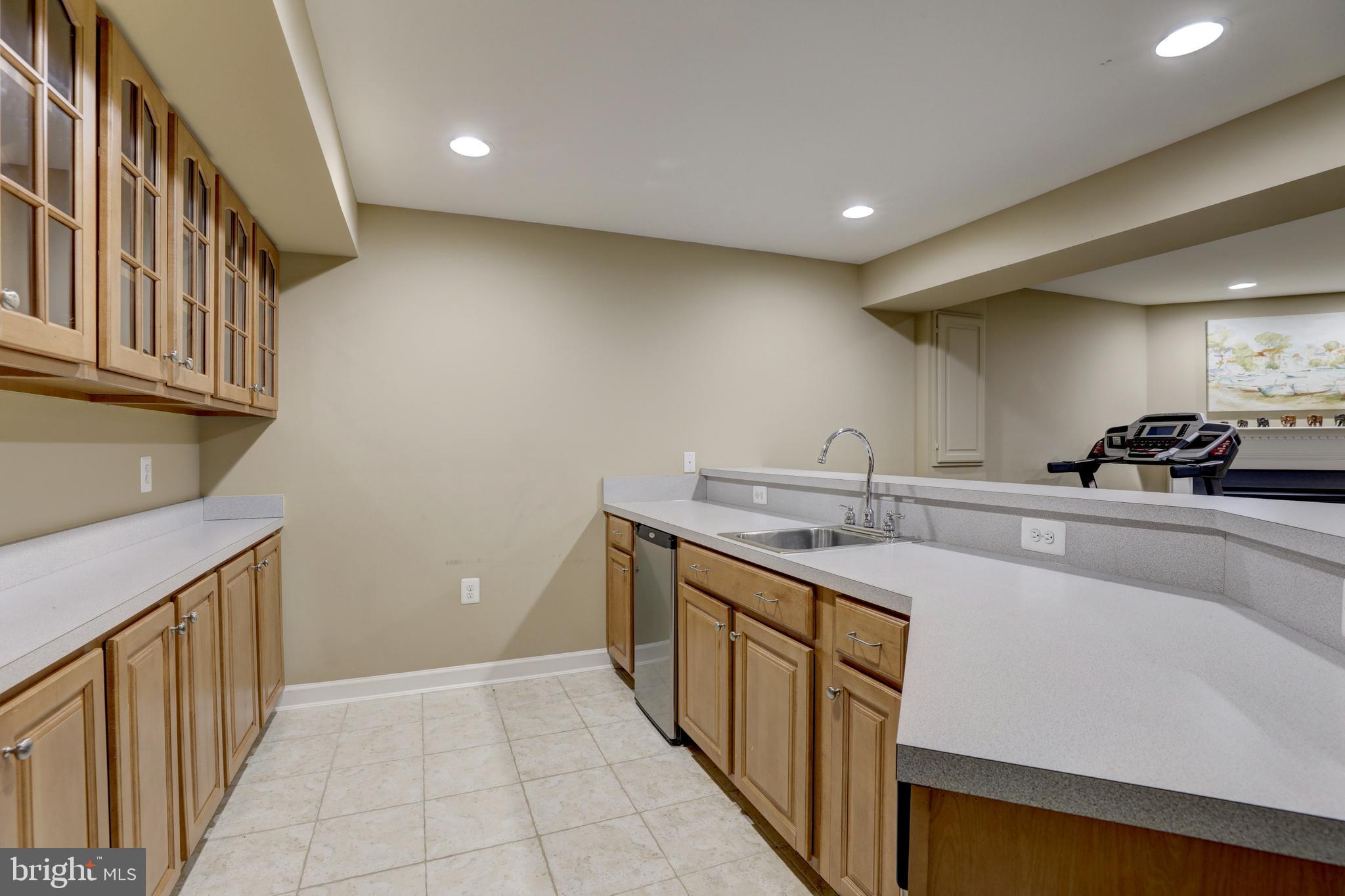 9124 Back Drop Drive Perry Hall, MD 21128 - Photo 52 of 69 a kitchen with a sink and cabinets