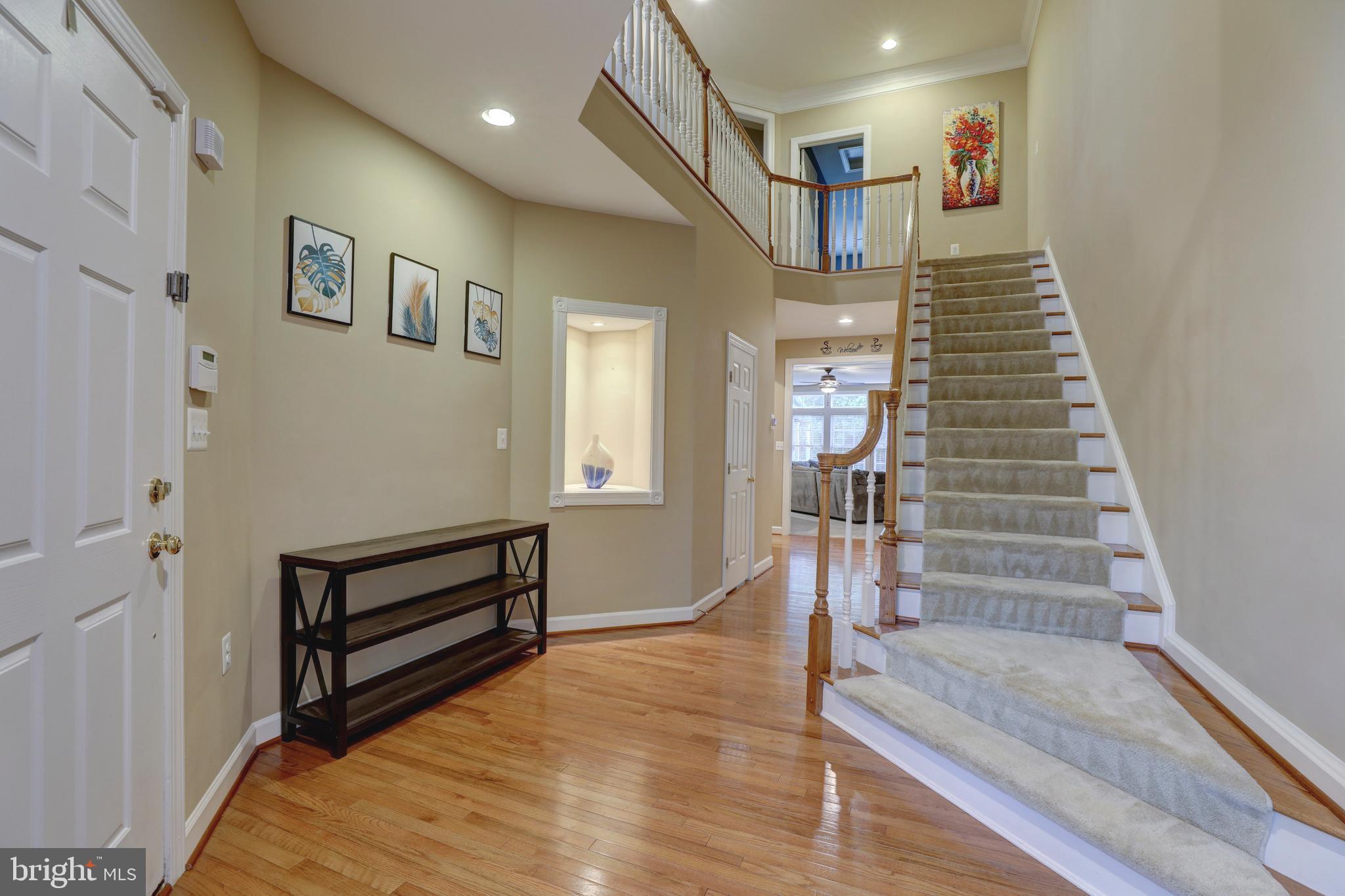 9124 Back Drop Drive Perry Hall, MD 21128 - Photo 7 of 69 a view of entryway and hall with wooden floor