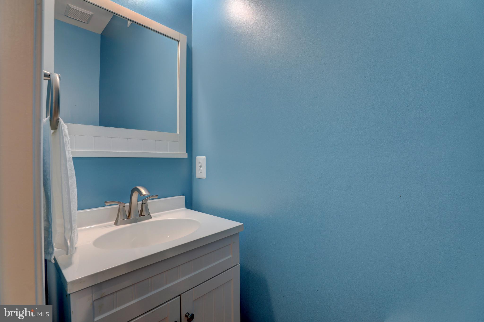9124 Back Drop Drive Perry Hall, MD 21128 - Photo 9 of 69 a bathroom with a sink and a mirror