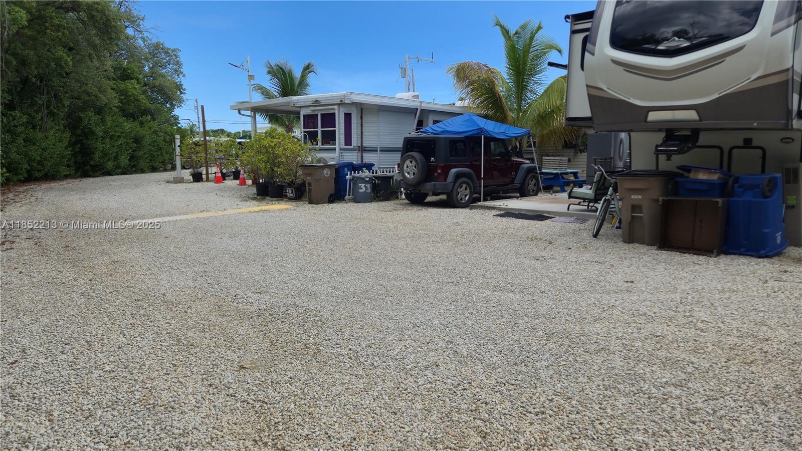 325 Calusa Street Key Largo, FL 33037 - Photo 6 of 24 a view of a car park in front of a building