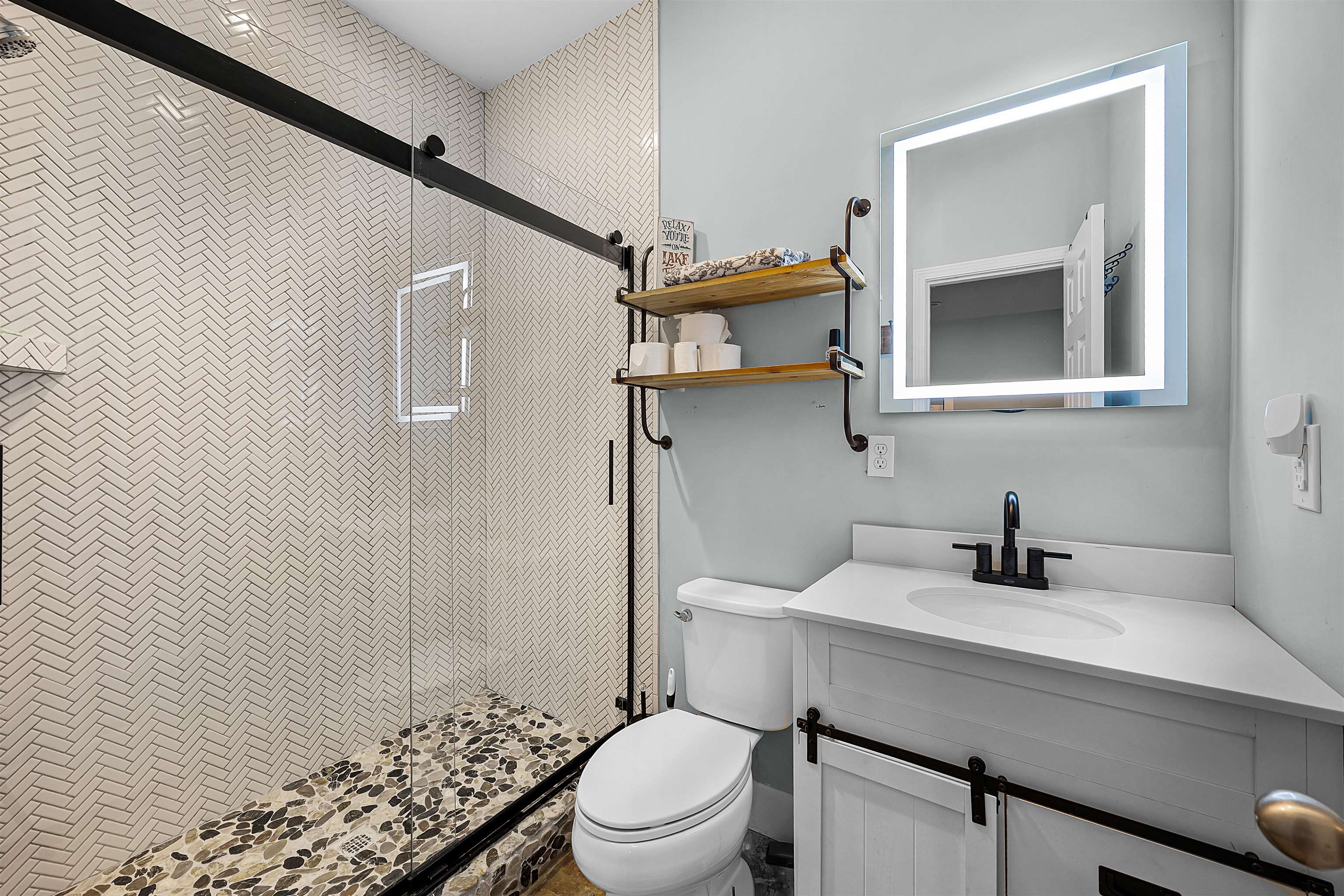 939 Eagle Point Drive Cherokee, AL 35616 - Photo 15 of 40 a bathroom with a sink a toilet and shower