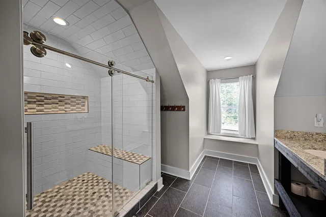 a bathroom with a sink a vanity and a mirror