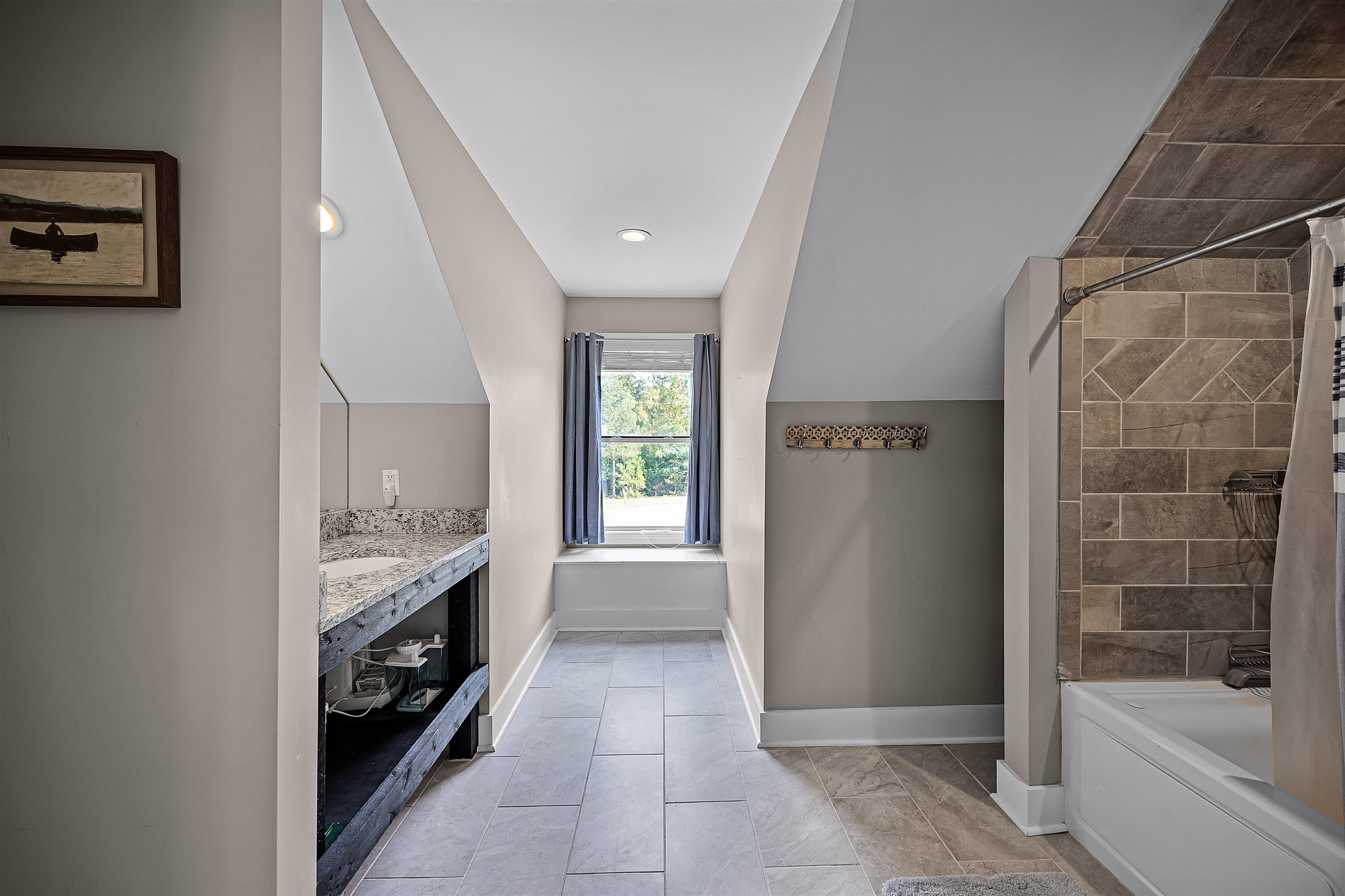 939 Eagle Point Drive Cherokee, AL 35616 - Photo 18 of 40 a bathroom with a sink a bathtub and a shower