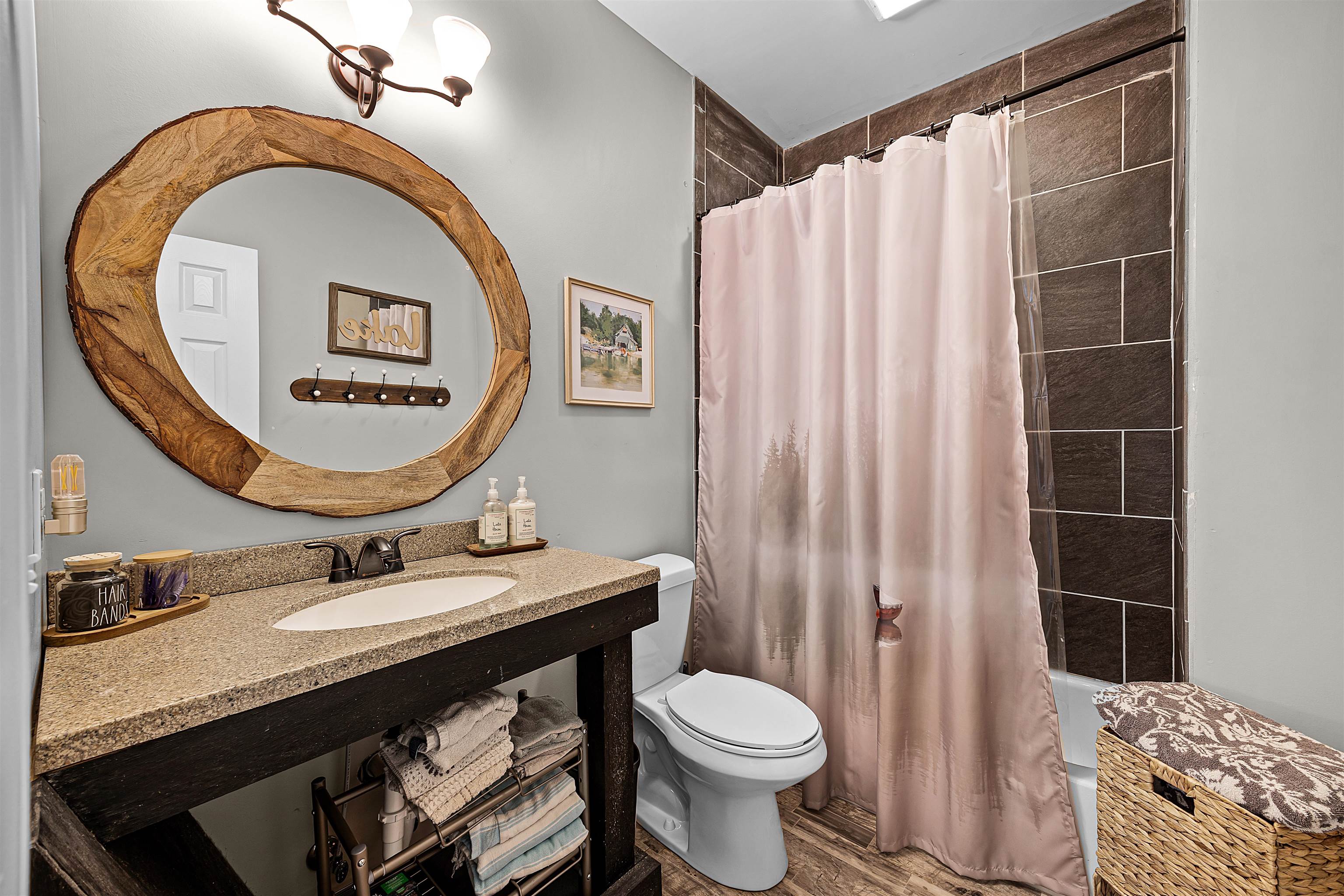 939 Eagle Point Drive Cherokee, AL 35616 - Photo 20 of 40 a bathroom with a sink a toilet and a mirror