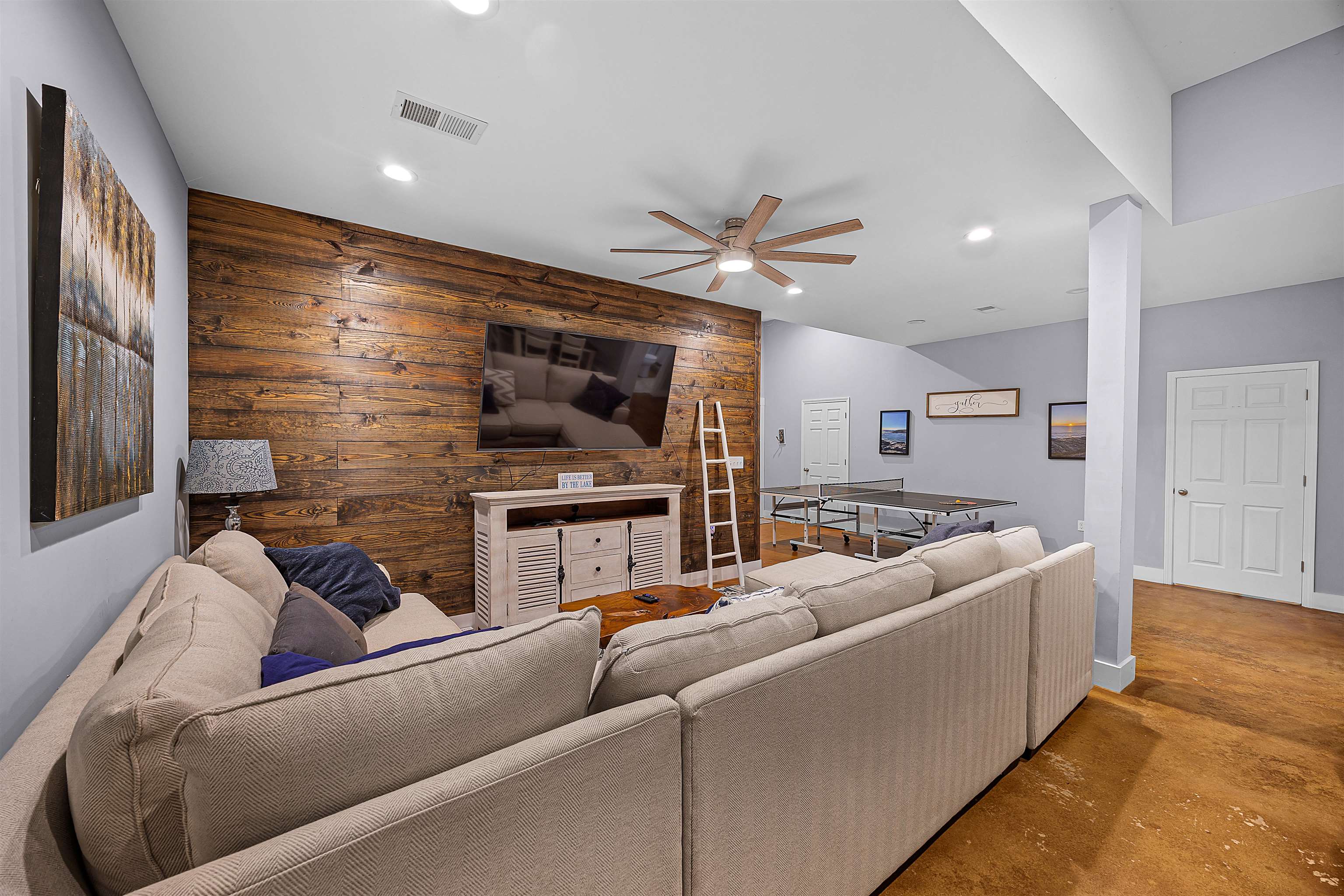 939 Eagle Point Drive Cherokee, AL 35616 - Photo 26 of 40 a living room with furniture and a flat screen tv
