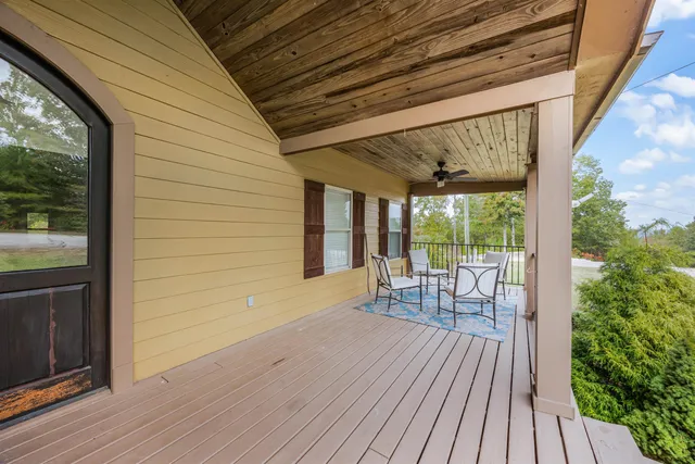 a porch with seating space and hardwood floor