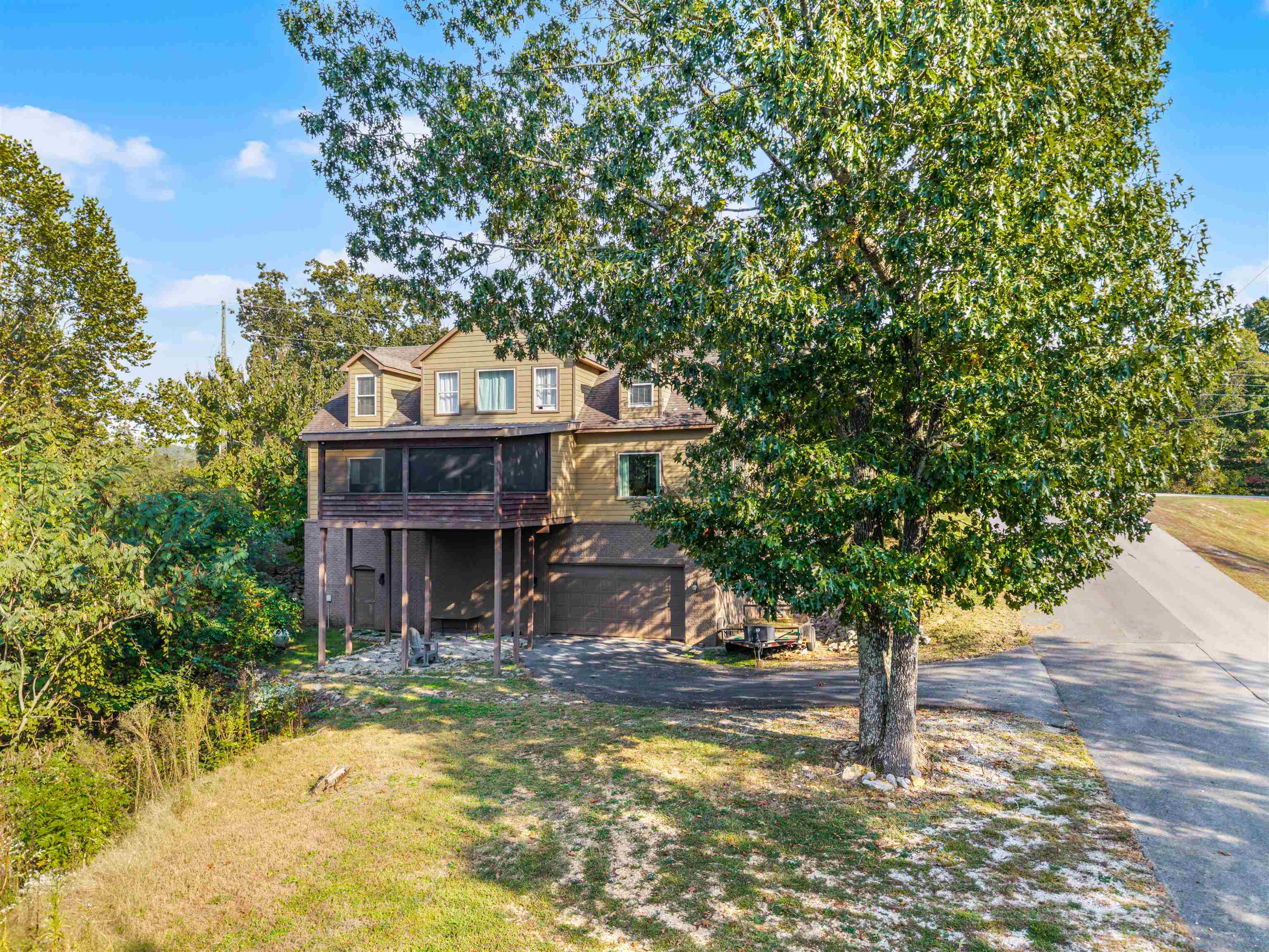 939 Eagle Point Drive Cherokee, AL 35616 - Photo 34 of 40 a front view of a house with a tree in the background
