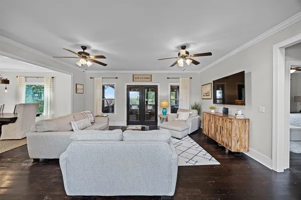 a living room with furniture and a flat screen tv