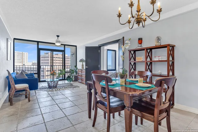 a view of a dining room with furniture window and outside view