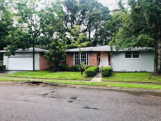 5875 Spellman Road Jacksonville, FL 32209 - Photo 1 of 14 a view of a house with a yard and large trees