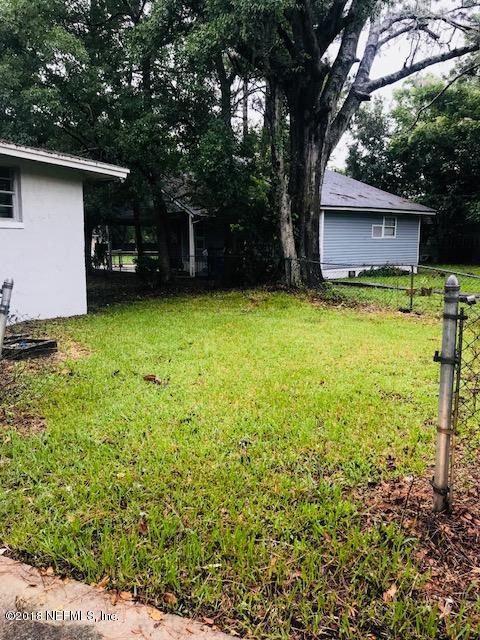 5875 Spellman Road Jacksonville, FL 32209 - Photo 14 of 14 a front view of a house with a yard