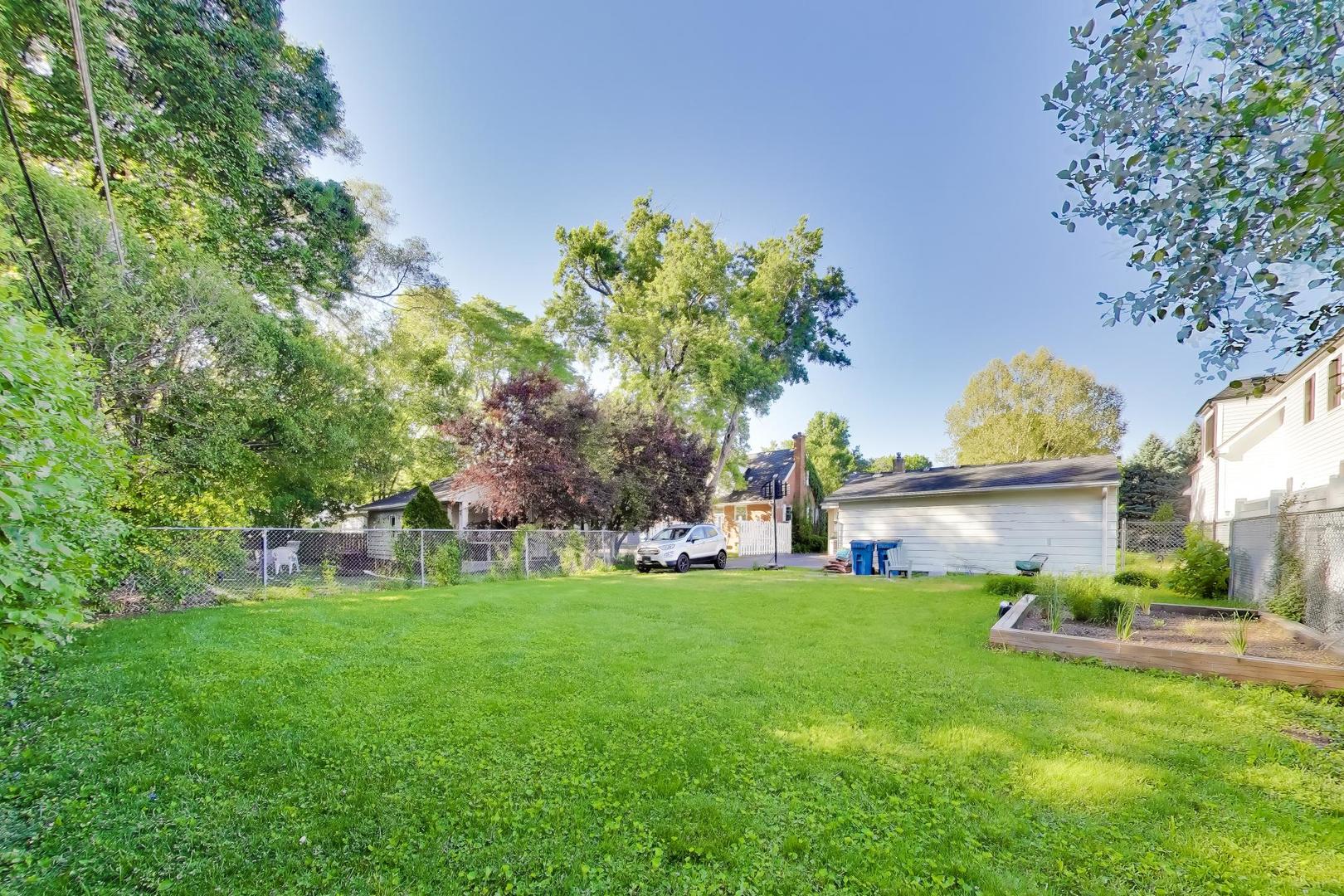 458 West Alma Street Elmhurst, IL 60126 - Photo 28 of 29 a view of a house with a yard and a garden