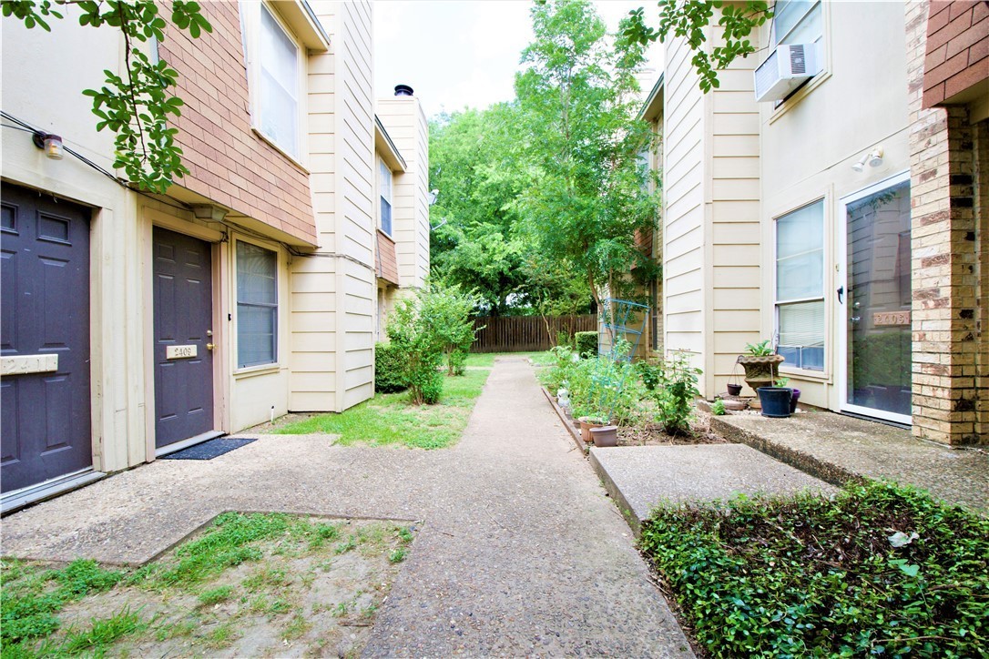 2409 MacArthur Drive, Unit 2409 Waco, TX 76708 - Photo 2 of 10 a view of a pathway with a house
