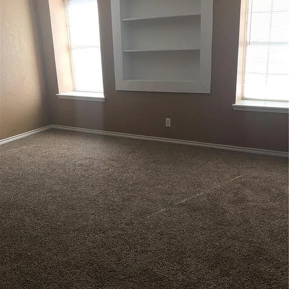2409 MacArthur Drive, Unit 2409 Waco, TX 76708 - Photo 8 of 10 an empty room with a window