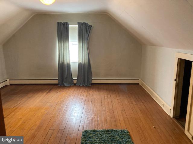 502 South Shenandoah Road Ringtown, PA 17967 - Photo 12 of 20 an empty room with wooden floor and windows
