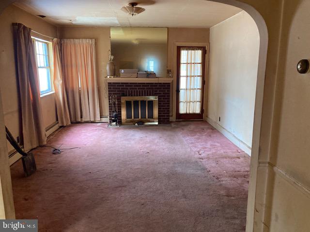 502 South Shenandoah Road Ringtown, PA 17967 - Photo 5 of 20 a view of empty room with fireplace and window