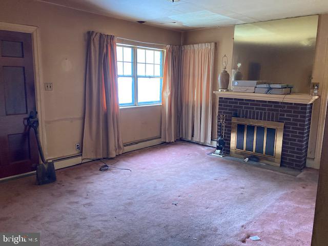 502 South Shenandoah Road Ringtown, PA 17967 - Photo 6 of 20 an empty room with windows fireplace and sink