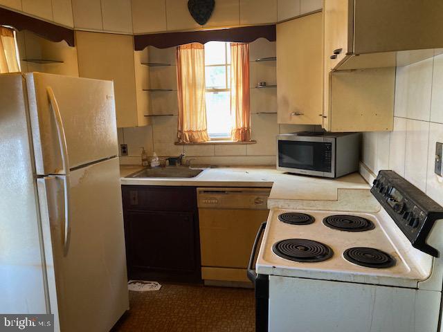 502 South Shenandoah Road Ringtown, PA 17967 - Photo 8 of 20 a kitchen with a refrigerator and a sink