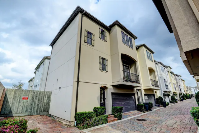 a front view of a house with a street