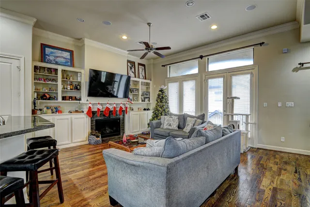 a living room with fireplace furniture and a flat screen tv