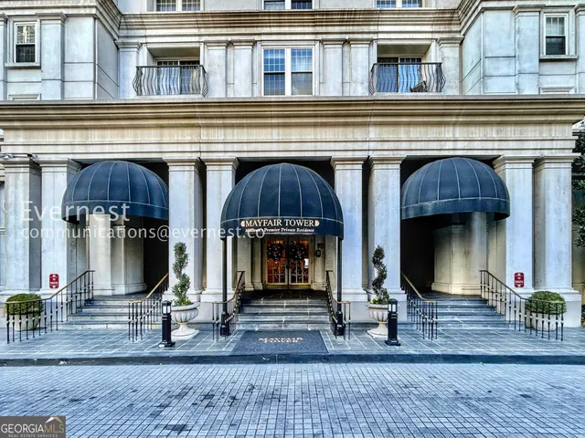 a view of a building with a entrance gate