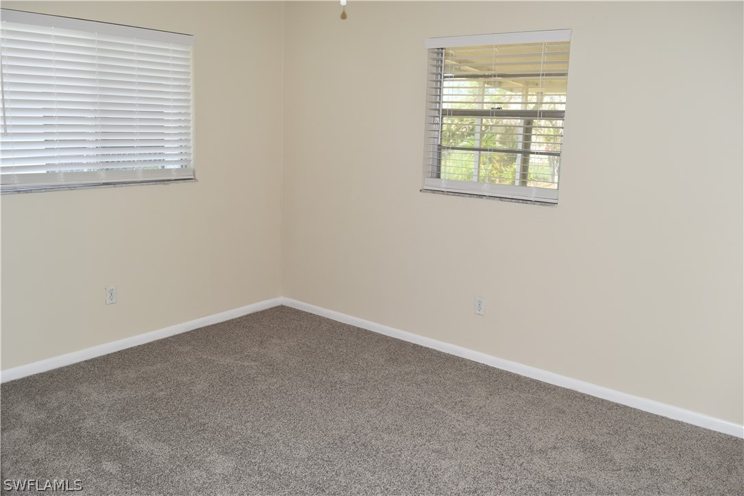 17404 Homewood Road Fort Myers, FL 33967 - Photo 20 of 26 an empty room with a window