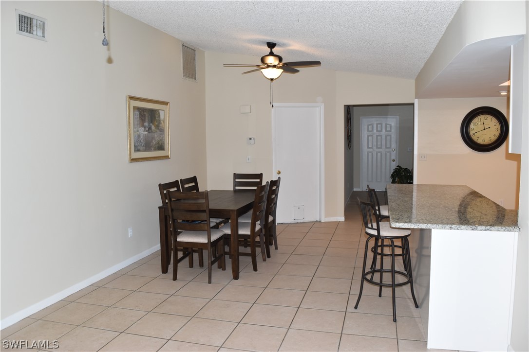 17404 Homewood Road Fort Myers, FL 33967 - Photo 10 of 26 a view of a dining room with furniture and chandelier