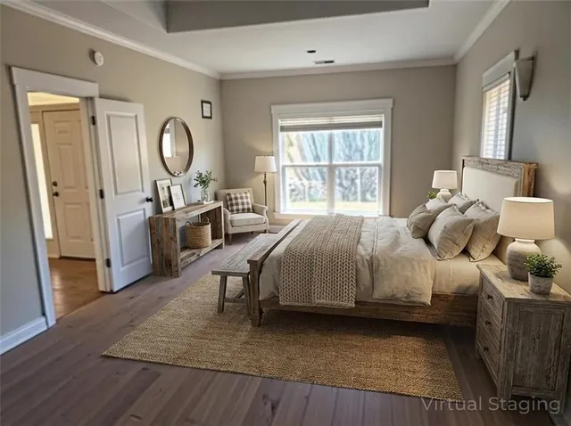 a bedroom with a bed window and wooden floor
