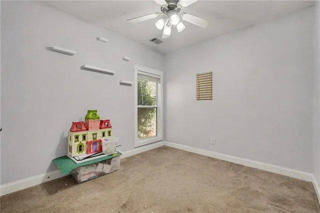 an empty room with toys and a window