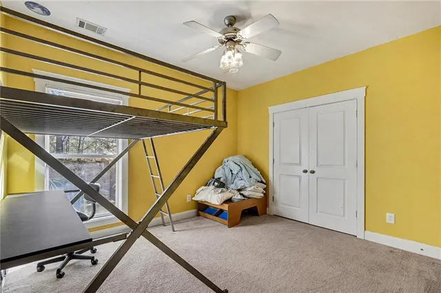 a view of a livingroom with furniture and stairs