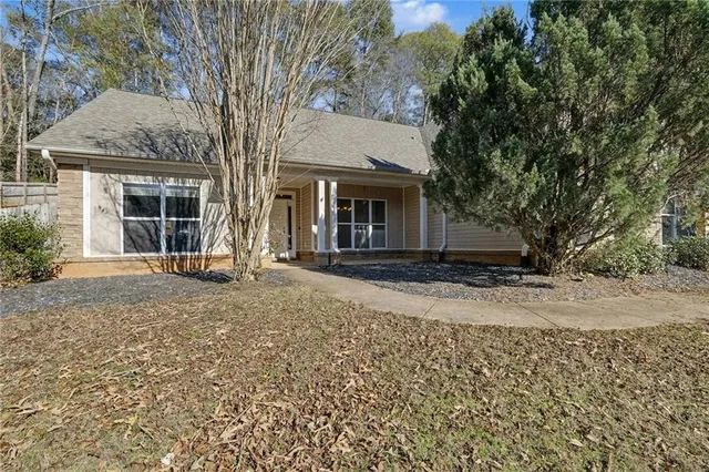 front view of a house with a trees
