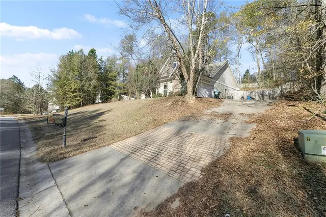 a view of a yard with snow on the road