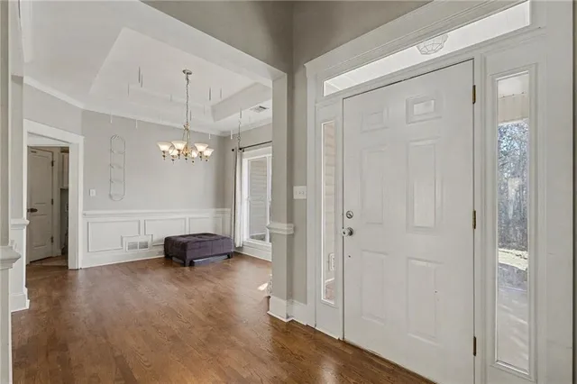 a view of a livingroom with furniture and a chandelier