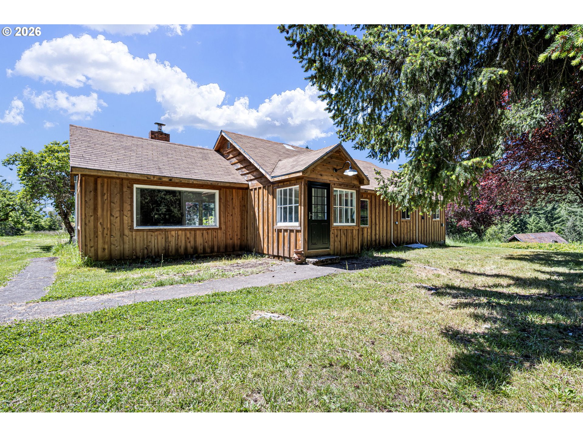 77521 Brock Road Oakridge, OR 97463 - Photo 3 of 48 a view of a house with a yard and tree s