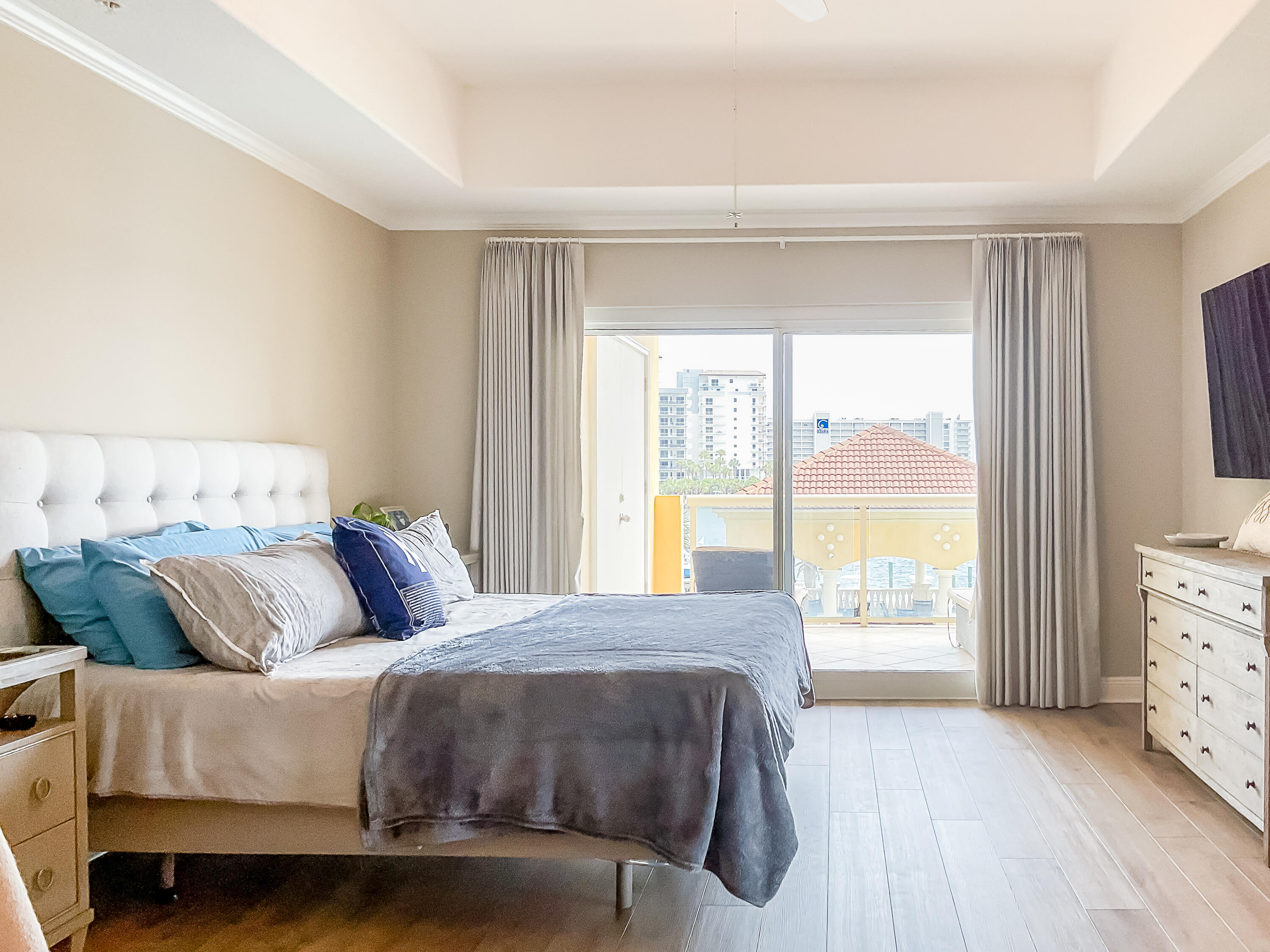770 Harbor Boulevard, Unit 1D Destin, FL 32541 - Photo 15 of 59 a bedroom with a bed and a large window