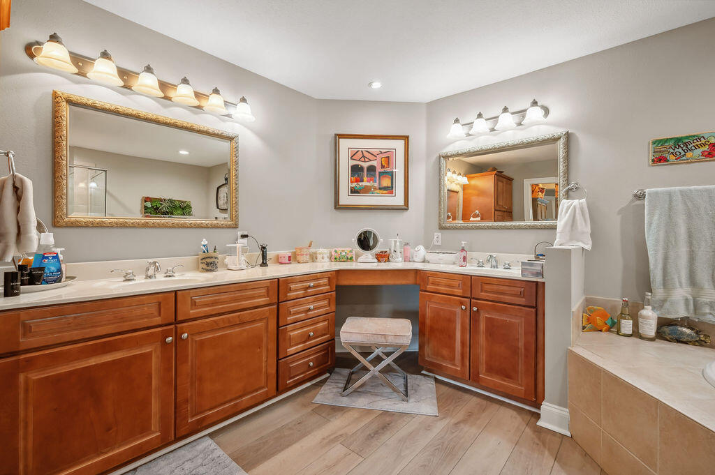 770 Harbor Boulevard, Unit 1D Destin, FL 32541 - Photo 19 of 59 a spacious bathroom with a double vanity sink double and mirror