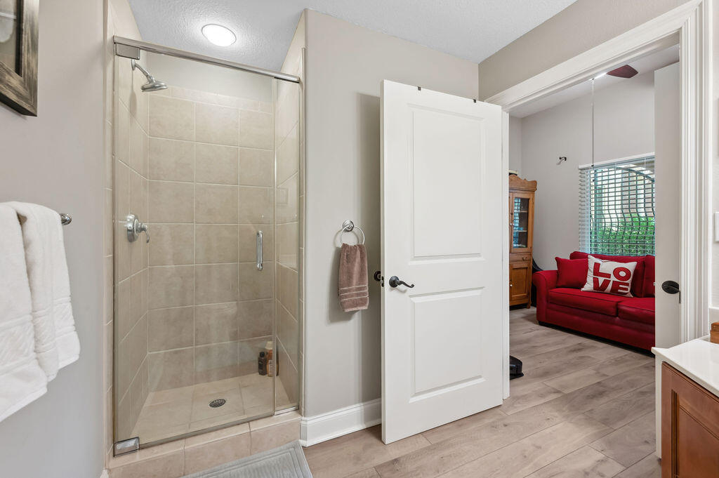 770 Harbor Boulevard, Unit 1D Destin, FL 32541 - Photo 23 of 59 a bathroom with a shower and a bath tub