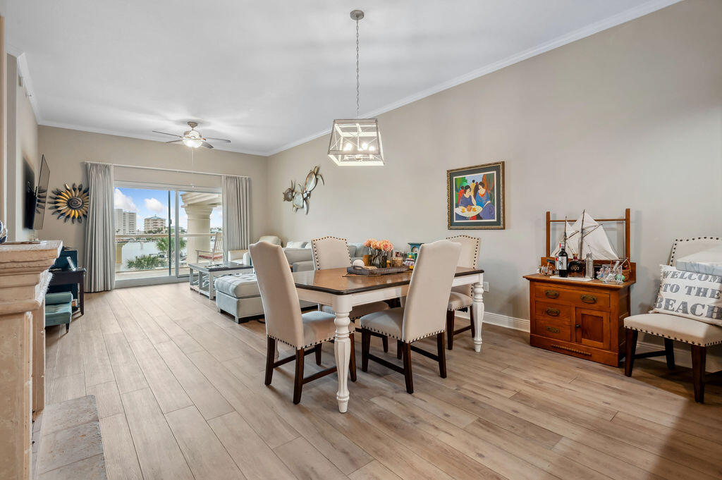 770 Harbor Boulevard, Unit 1D Destin, FL 32541 - Photo 34 of 59 a view of a dining room with furniture window and wooden floor