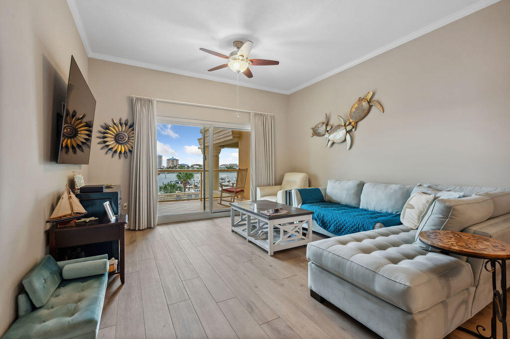 770 Harbor Boulevard, Unit 1D Destin, FL 32541 - Photo 37 of 59 a living room with furniture and a flat screen tv