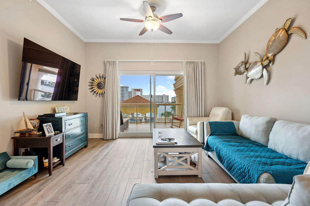 770 Harbor Boulevard, Unit 1D Destin, FL 32541 - Photo 38 of 59 a living room with furniture and a flat screen tv