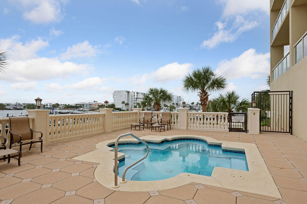 770 Harbor Boulevard, Unit 1D Destin, FL 32541 - Photo 50 of 59 a view of a chairs on a terrace